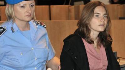 Amanda Knox, right, escorted by a penitentiary guard, arrives at the courthouse for the appeal trial in Perugia, Italy, Friday, Sept. 23, 2011. (AP Photo / Stefano Medici) 
