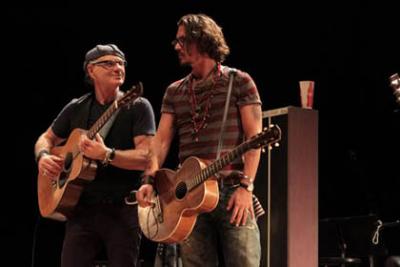 Photo shows Bill Carter performing with Johnny Depp.
