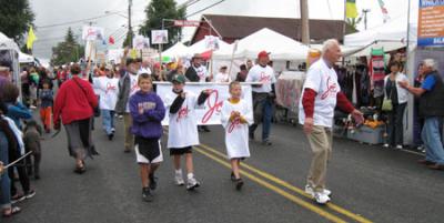 Joe Ulatoski campains for Fire Commisioner during the Grand Parade at Strawberry Festival