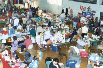 This is a photo of a large flea market. It is not the actual “Vashon’s largest Flea Market”.To be a part of the actual Largest Flea market on Vashon, email maria@openspacevashon.com to reserve your space. Or show up ‘O” Space, 18870, 103rd Ave SW, Vashon, Sunday, June 2 at 10am to shop.