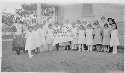 The girls at the Salvation Army orphanage in El Paso, Texas, sometime in the early 1920s. My mother is the little girl in the front row immediately to the right of the Motherhood banner. My aunt is in the back row, fourth from the left.