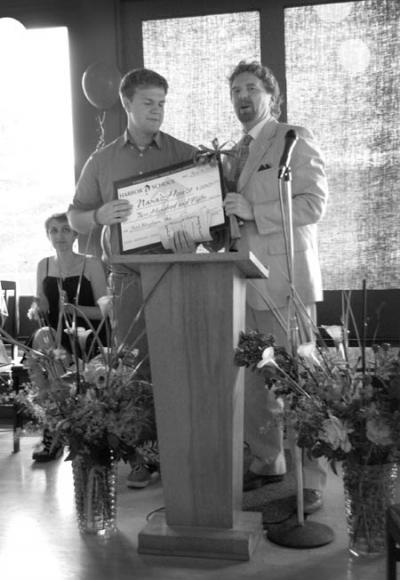 Joshua Bingham (left) receives Harbor School’s Young Alumni Award from James Cardo, Head of School (right).  Photo credit: Allison Reid