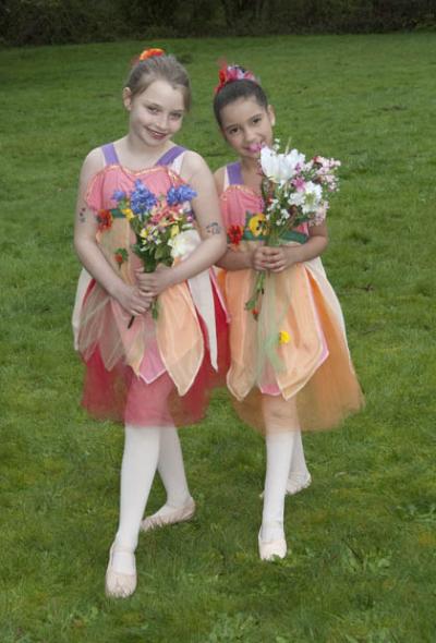 Myra Butler and Isabel Forest (L to R), portray the flowers in Cinderella’s garden. photo by Kathleen Webster