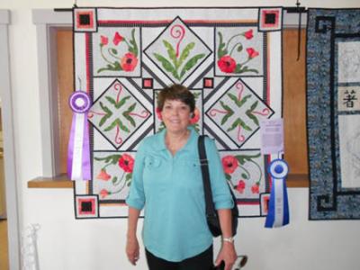 Paula Finlinson’s quilt “Poppies” was the winner of the “Best of Show” ribbon.