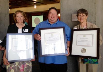 From left: Laurie Tucker, Brandon Reynon, Rayna Holtz holding their Peace and Friendship Awards at the annual meeting of the Washington State Historical Society at the Washington State History Museum June 20,