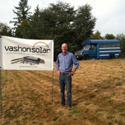 Gib Dammann with the Vashon Solar LLC banner at Harbor School, where installation of the framework that will support the solar panels has BEGUN!! Artisan Electric is the contractor. Phase 1 memberships are available until the October 1 deadline and then Phase 2 will proceed