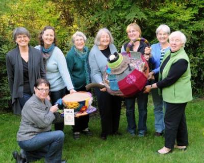 “ Stitchin’ For a Kitchen” group with the Yarn bombed teapot and cup and saucer