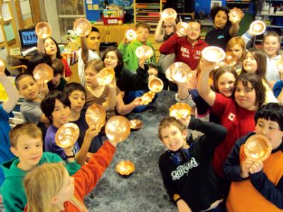 Pride ‘n joy: Chautauqua 5th graders display lustrous copper hammered bowls created in a 2011 VAIS residency partnership with art teacher Carolyn Buehl and artist Ivonne Kommer. This residency has become an annual 5th grade student spring tradition.